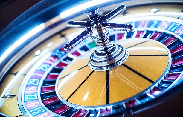 Live roulette table interface on mobile phone showing dealer and betting board